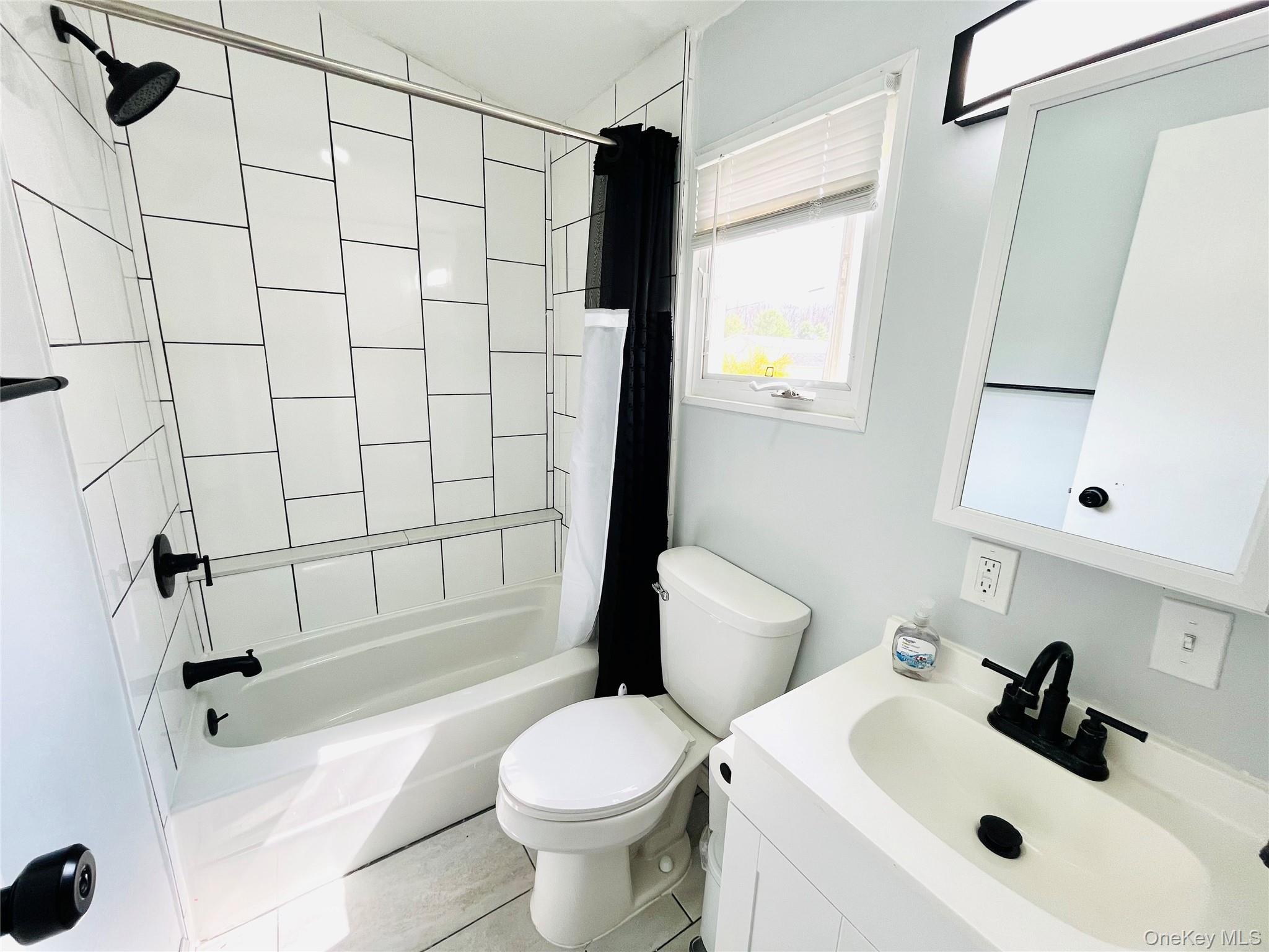 723 Beekman Road, Unit 42 Hopewell Junction, NY 12533 - Photo 14 of 16 a bathroom with a sink toilet and shower