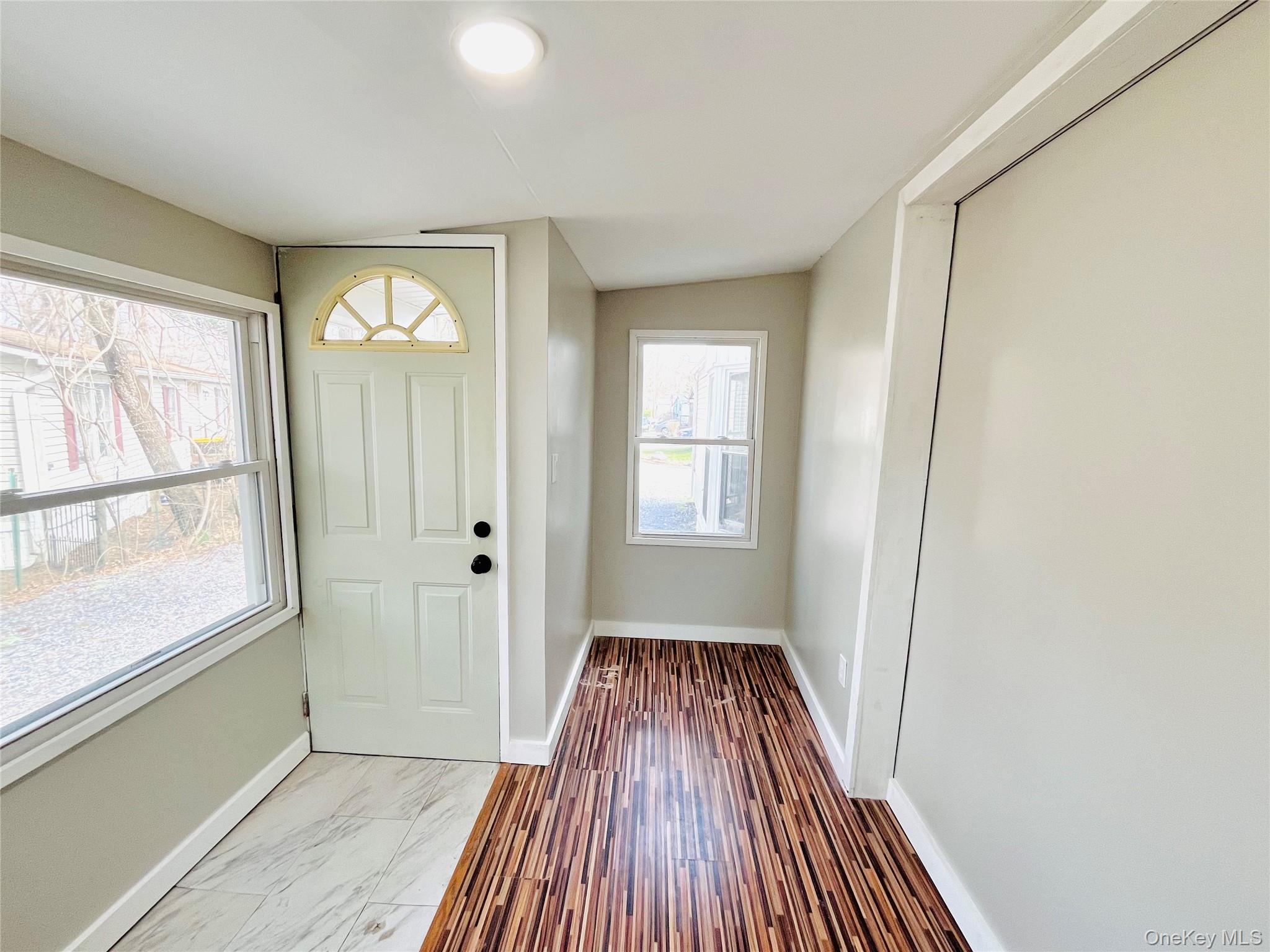 723 Beekman Road, Unit 42 Hopewell Junction, NY 12533 - Photo 16 of 16 wooden floor in an empty room with a window