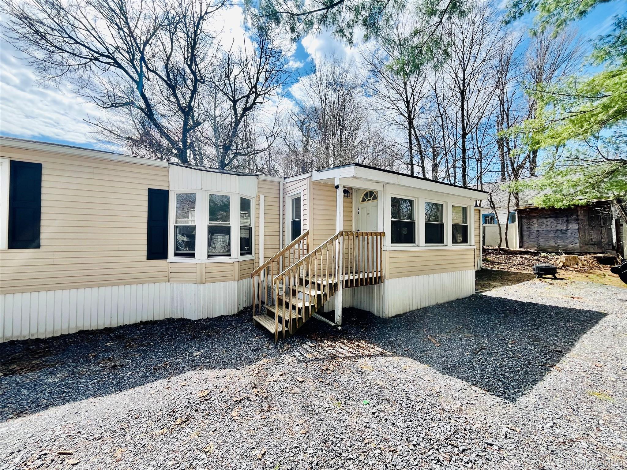 723 Beekman Road, Unit 42 Hopewell Junction, NY 12533 - Photo 5 of 16 a view of a house with a yard