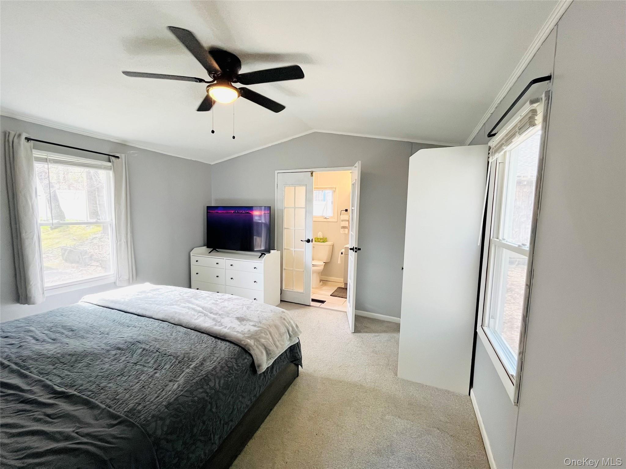 723 Beekman Road, Unit 42 Hopewell Junction, NY 12533 - Photo 10 of 16 a bedroom with a bed and a television