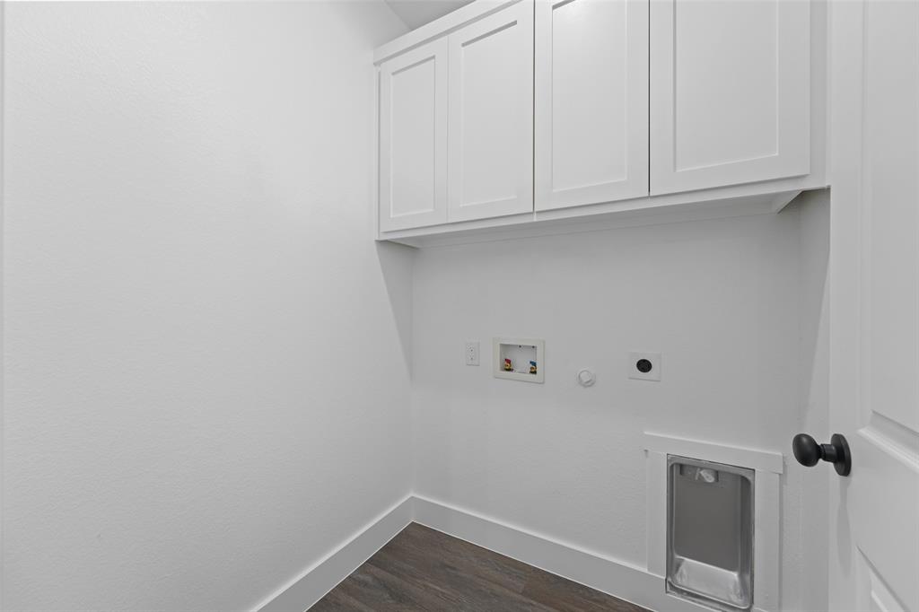 122 East Beachwood Loop Trinidad, TX 75163 - Photo 32 of 35 Laundry area featuring wood-finish flooring, white shaker-style cabinetry, and a dedicated utility sink