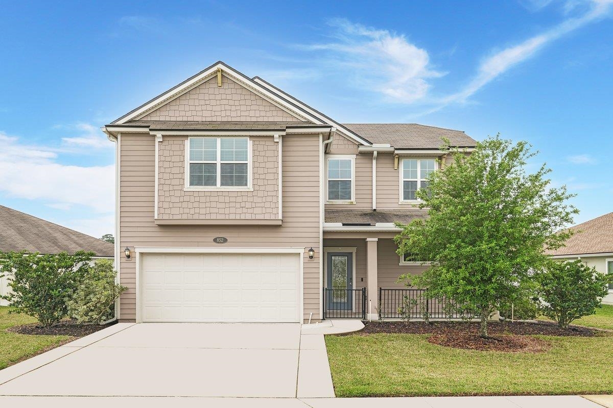 852 Deer Crossing Road St. Augustine, FL 32086 - Photo 1 of 47 View of front facade featuring a front lawn and a garage