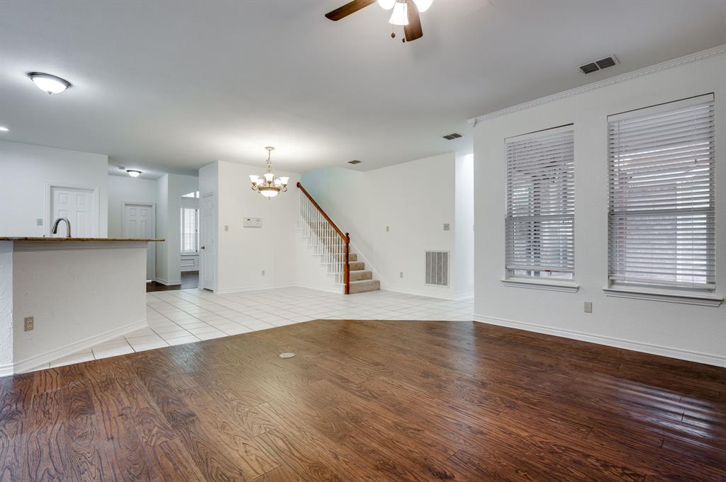 3600 Leighton Ridge Drive Plano, TX 75025 - Photo 19 of 38 an empty room with wooden floor and windows
