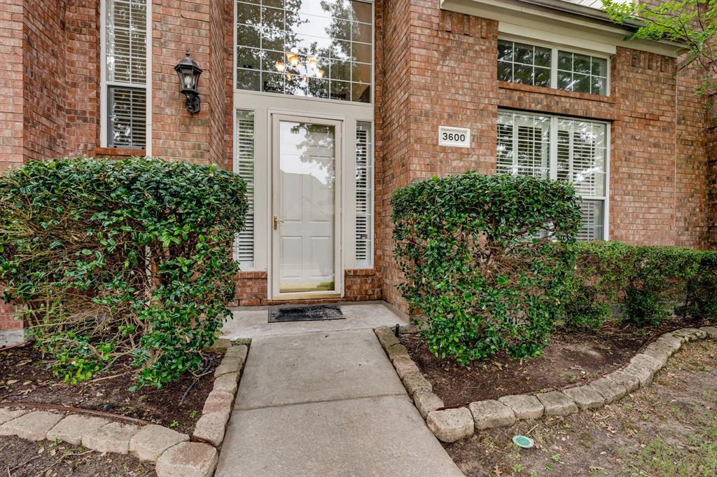 3600 Leighton Ridge Drive Plano, TX 75025 - Photo 3 of 38 front view of a house with a yard