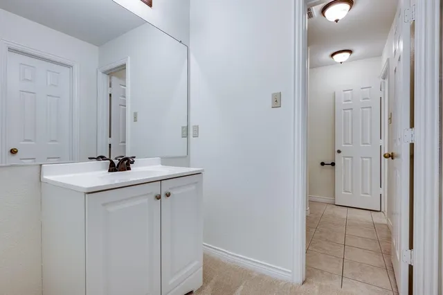 a bathroom with a sink and mirror