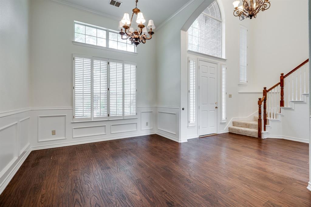 3600 Leighton Ridge Drive Plano, TX 75025 - Photo 6 of 38 a view of an empty room with wooden floor and a window