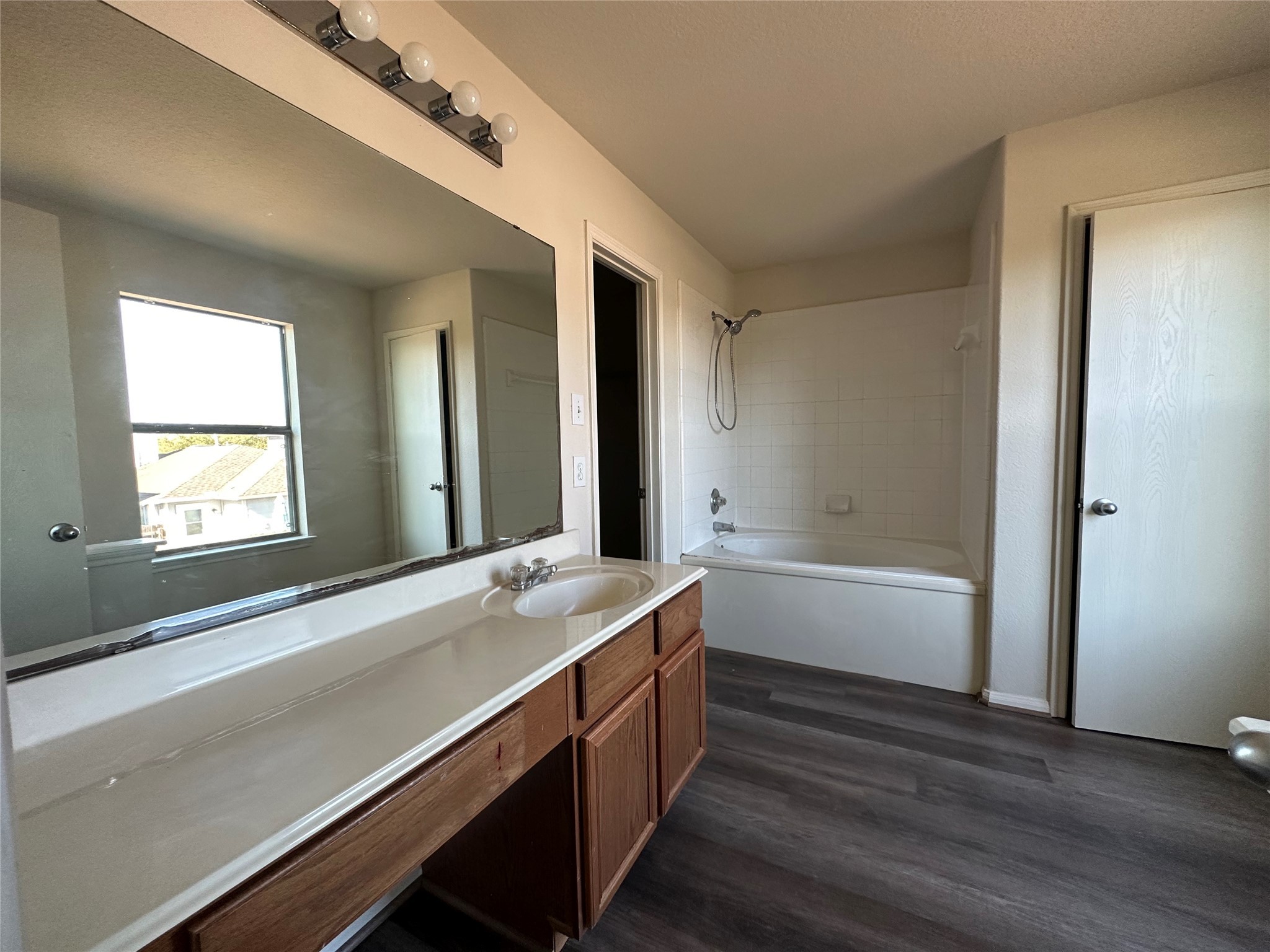 6602 Providence View Lane Houston, TX 77049 - Photo 12 of 17 a bathroom with a bathtub and a sink