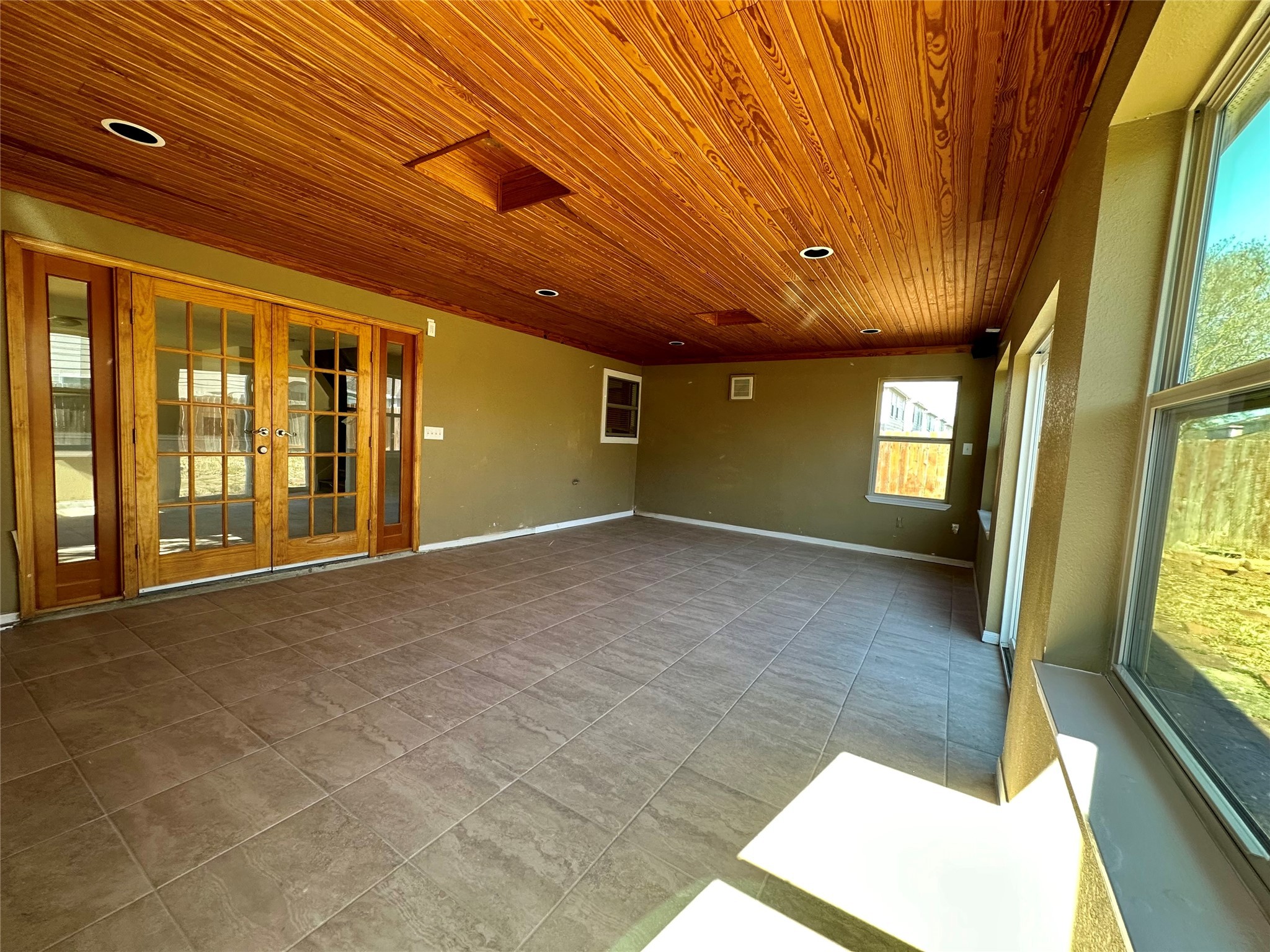 6602 Providence View Lane Houston, TX 77049 - Photo 16 of 17 a view of an empty room with large windows