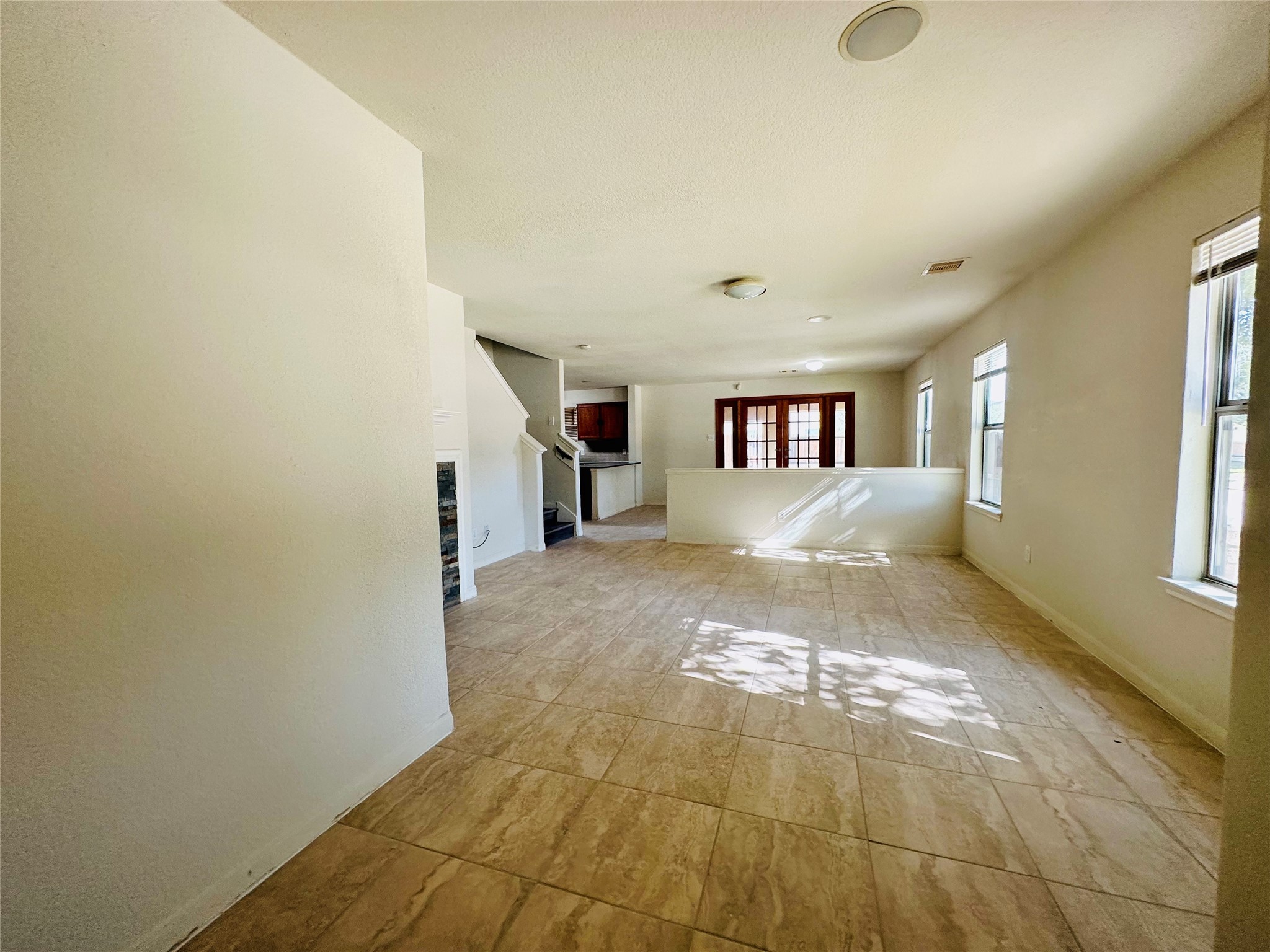 6602 Providence View Lane Houston, TX 77049 - Photo 5 of 17 a view of a big room with windows and fireplace
