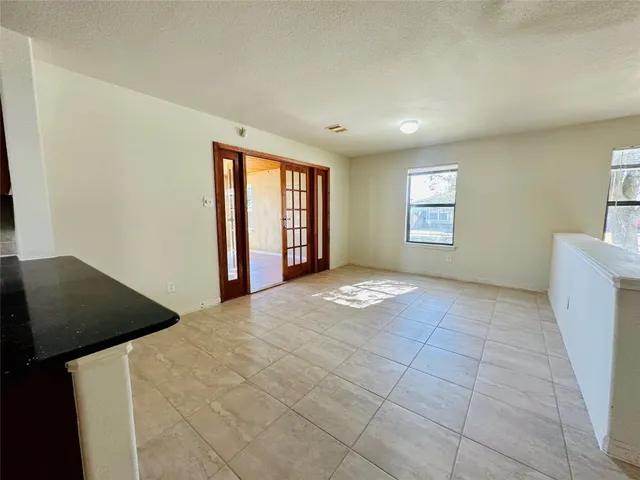 a view of an empty room and window