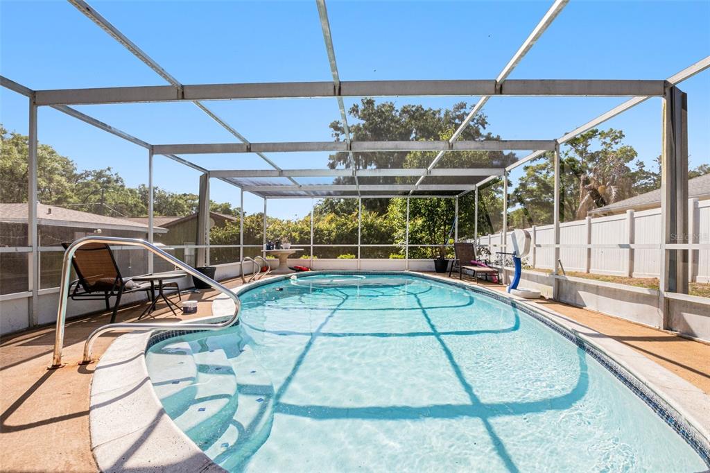 210 Red Rose Lane Inverness, FL 34452 - Photo 11 of 14 a view of a swimming pool with a patio