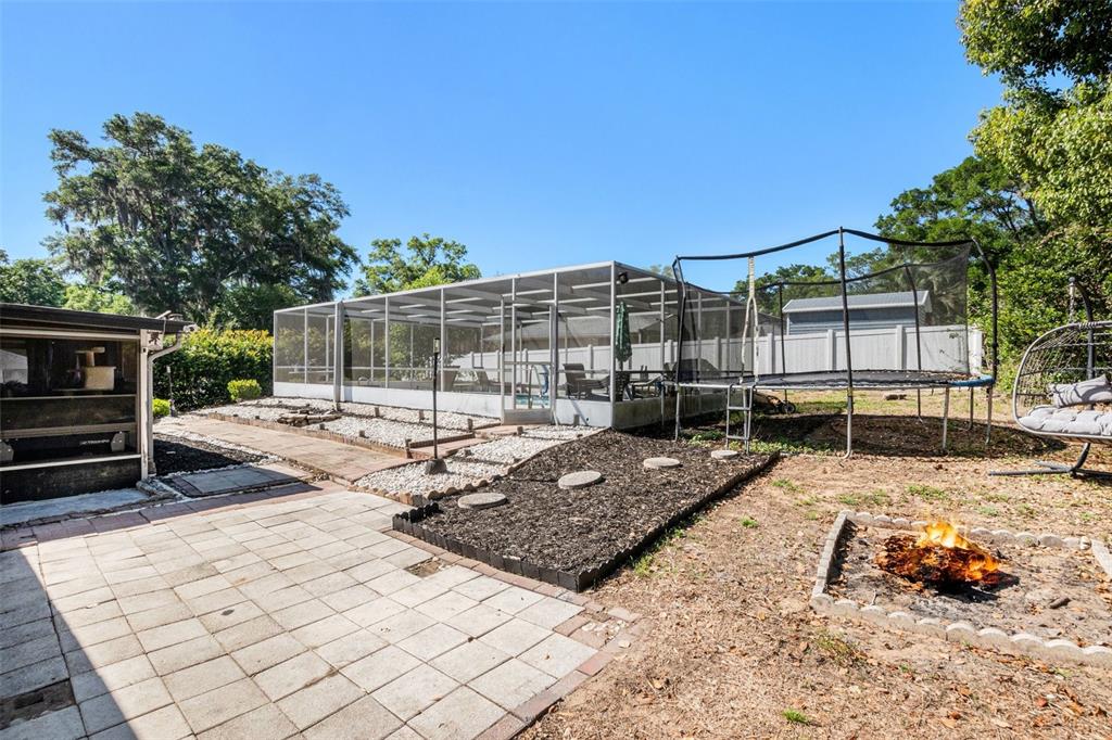 210 Red Rose Lane Inverness, FL 34452 - Photo 14 of 14 a view of a backyard with sitting area