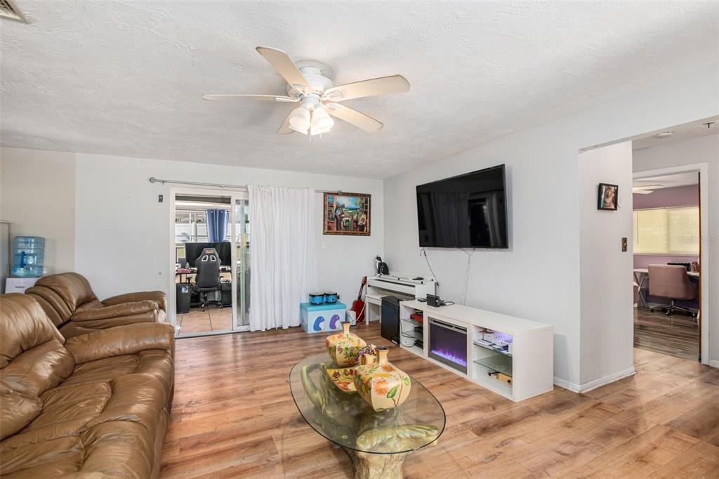 210 Red Rose Lane Inverness, FL 34452 - Photo 4 of 14 a living room with furniture and a flat screen tv
