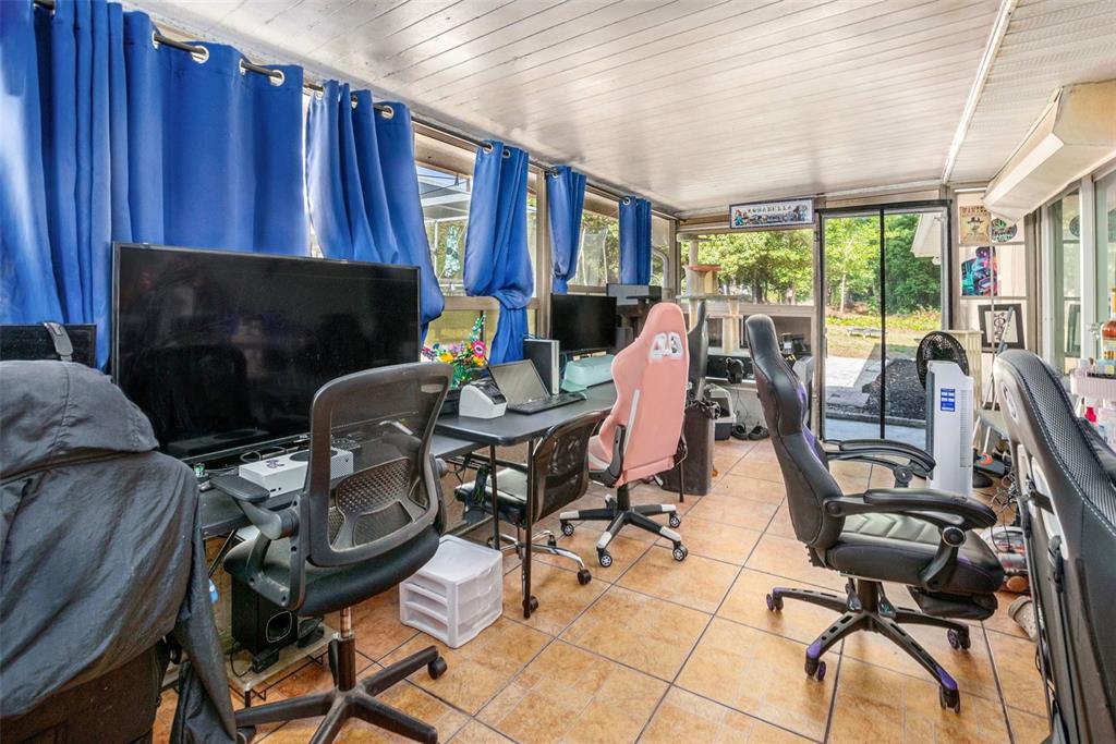 210 Red Rose Lane Inverness, FL 34452 - Photo 8 of 14 a work room with furniture and a fireplace