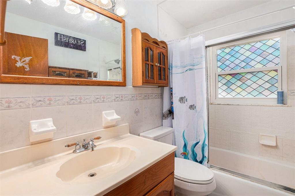 210 Red Rose Lane Inverness, FL 34452 - Photo 9 of 14 a bathroom with a sink toilet and shower