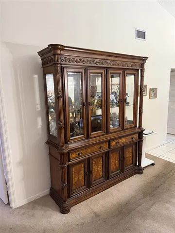 a view of a car park in front of house