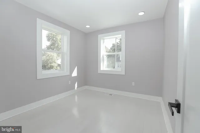 an empty room with windows