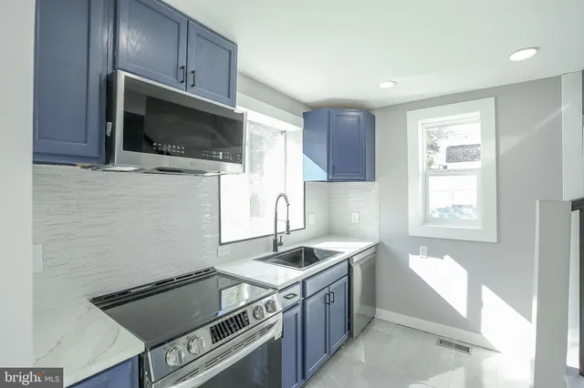 a kitchen with a stove and a microwave