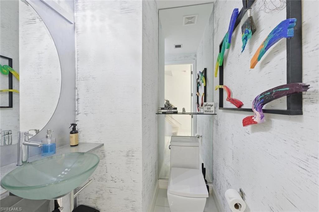 7345 Rockefeller Drive Naples, FL 34119 - Photo 16 of 42 Powder Room 1st floor