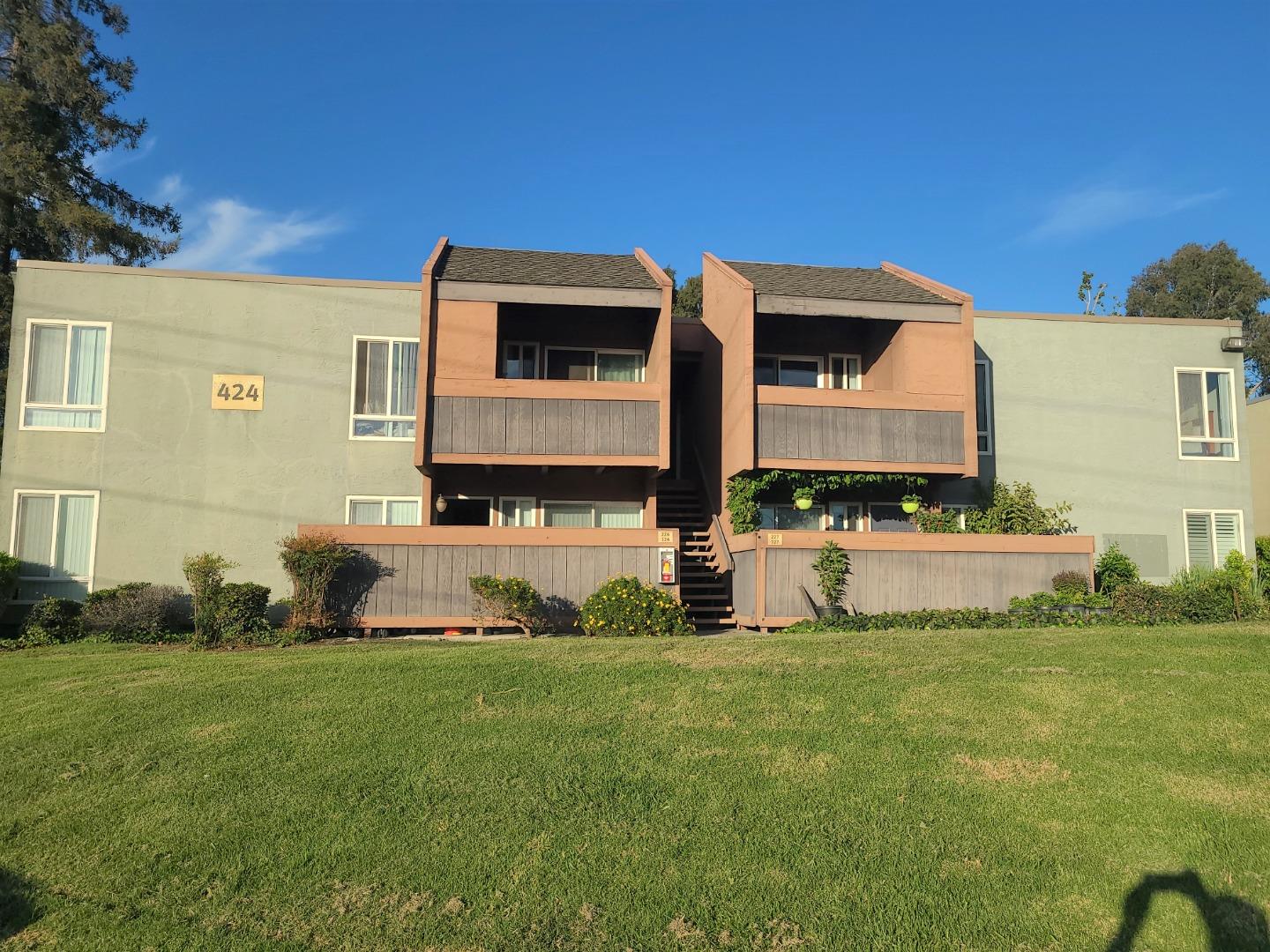 424 Dempsey Road, Unit 227 Milpitas, CA 95035 - Photo 1 of 24 a front view of a house with a yard