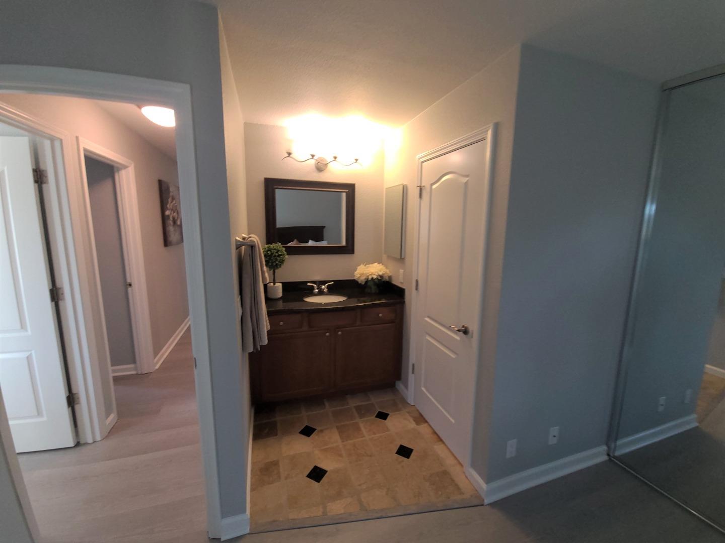 424 Dempsey Road, Unit 227 Milpitas, CA 95035 - Photo 18 of 24 a bathroom with a sink toilet and shower