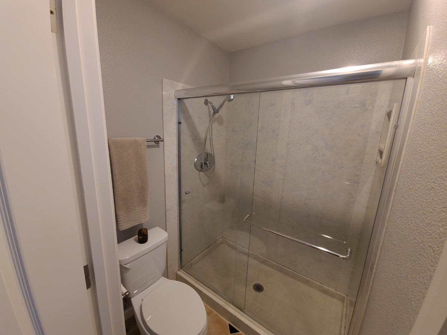 424 Dempsey Road, Unit 227 Milpitas, CA 95035 - Photo 19 of 24 a bathroom with a shower and toilet