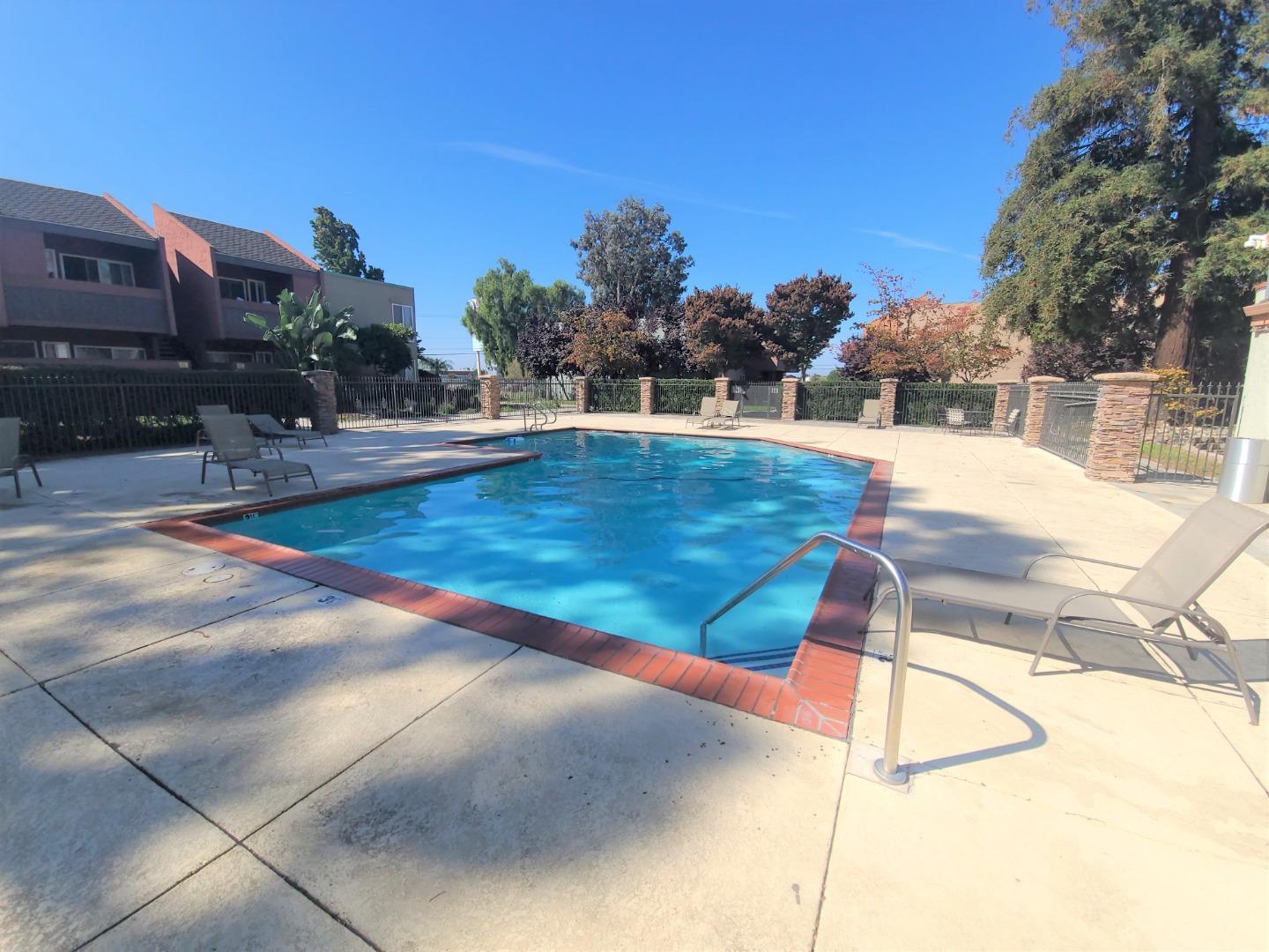 424 Dempsey Road, Unit 227 Milpitas, CA 95035 - Photo 21 of 24 a view of a swimming pool with a yard