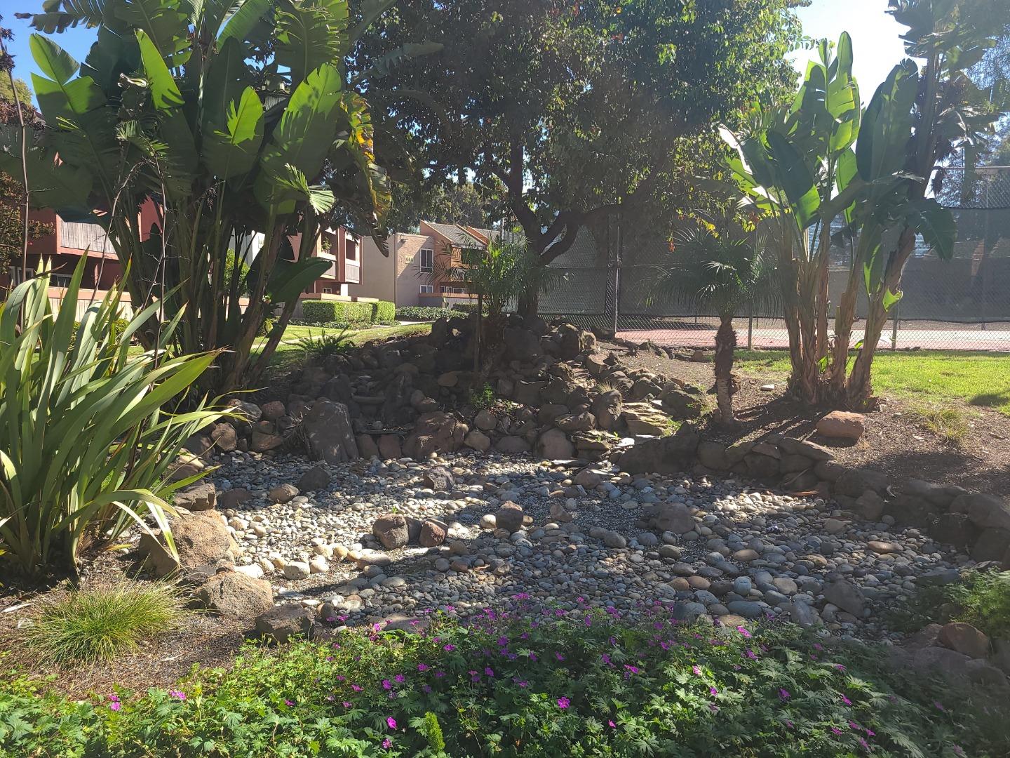 424 Dempsey Road, Unit 227 Milpitas, CA 95035 - Photo 24 of 24 a view of a tree in a yard