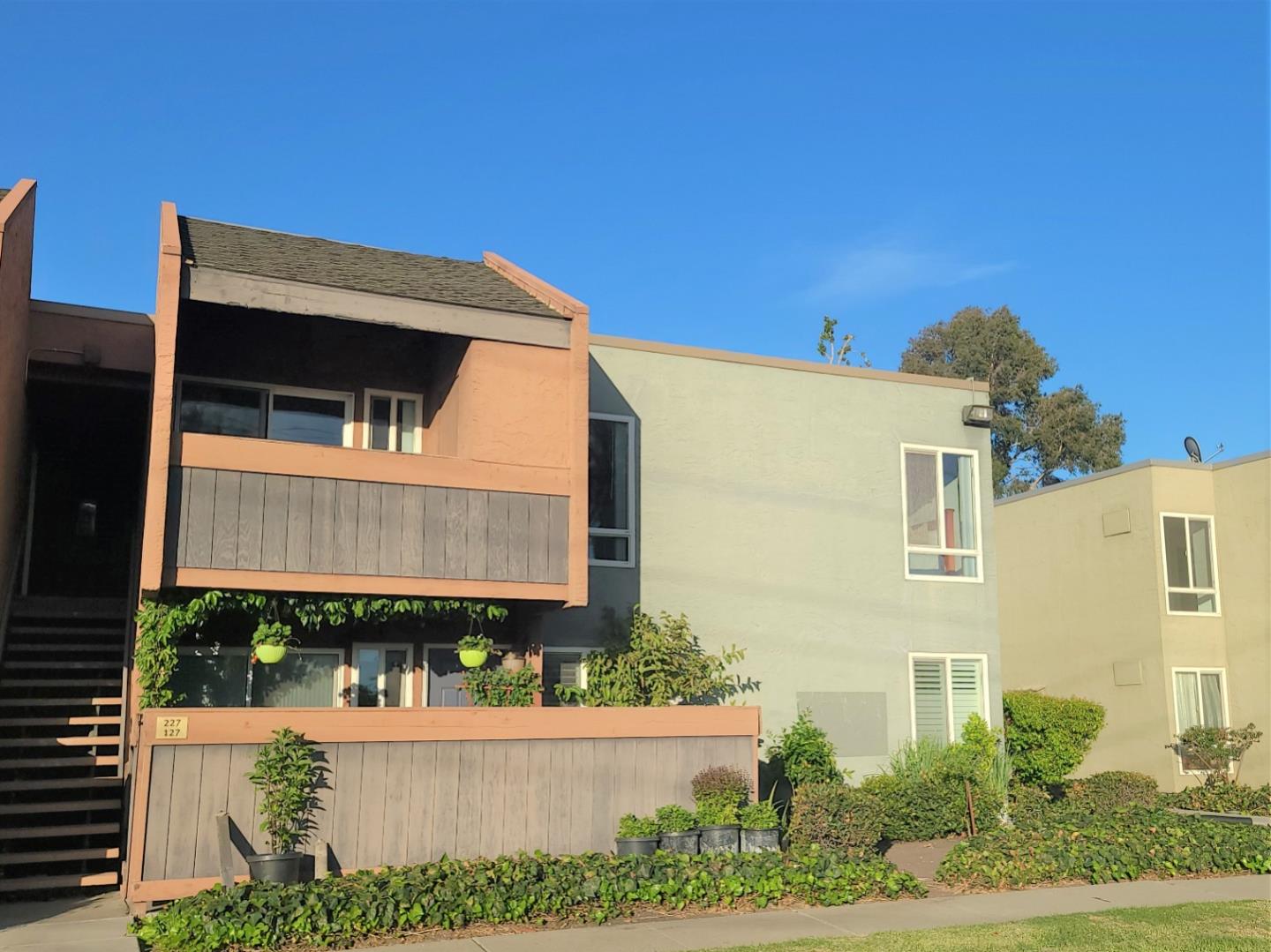 424 Dempsey Road, Unit 227 Milpitas, CA 95035 - Photo 3 of 24 a front view of a house with street