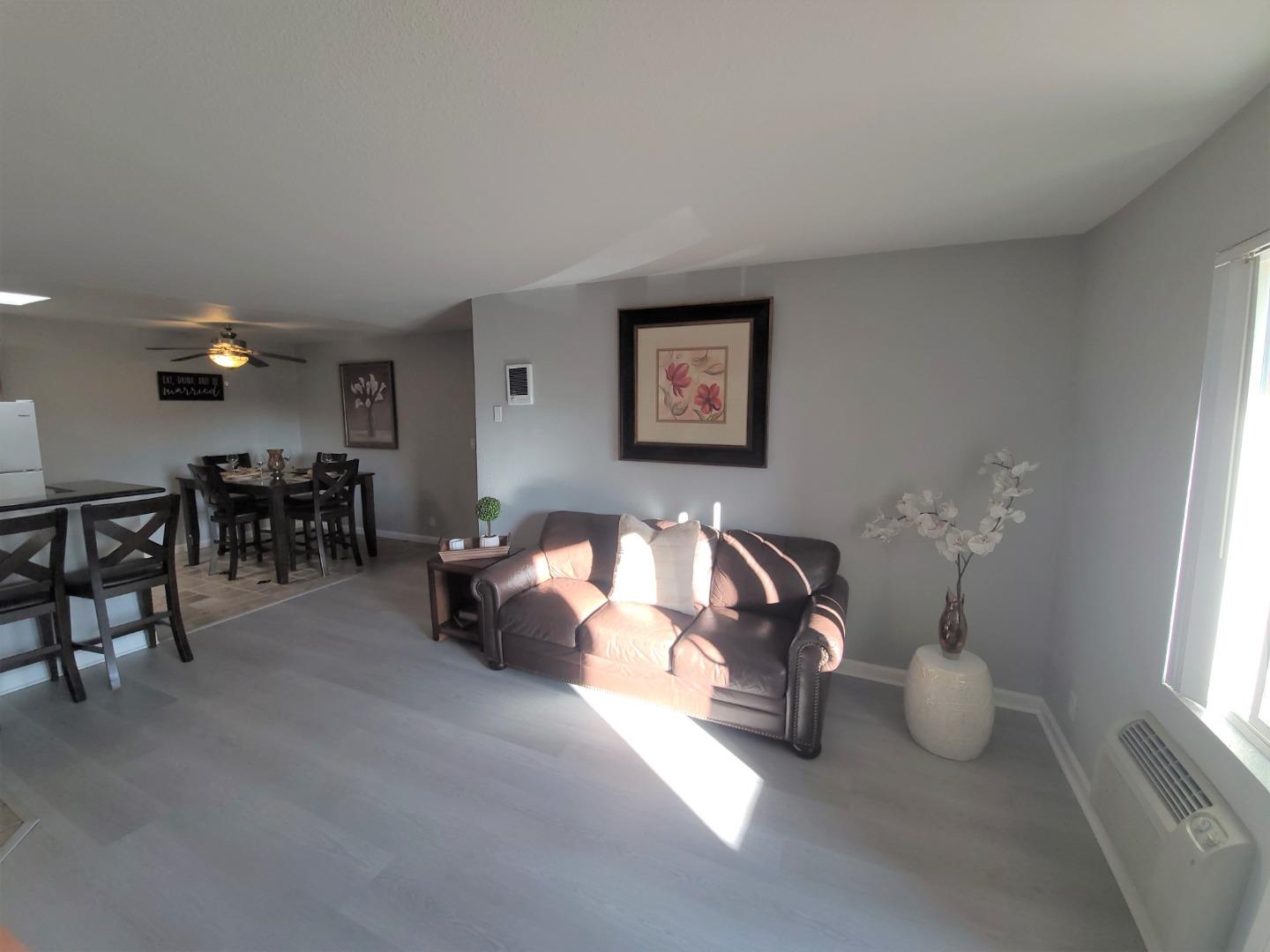 424 Dempsey Road, Unit 227 Milpitas, CA 95035 - Photo 6 of 24 a living room with furniture a window and a table