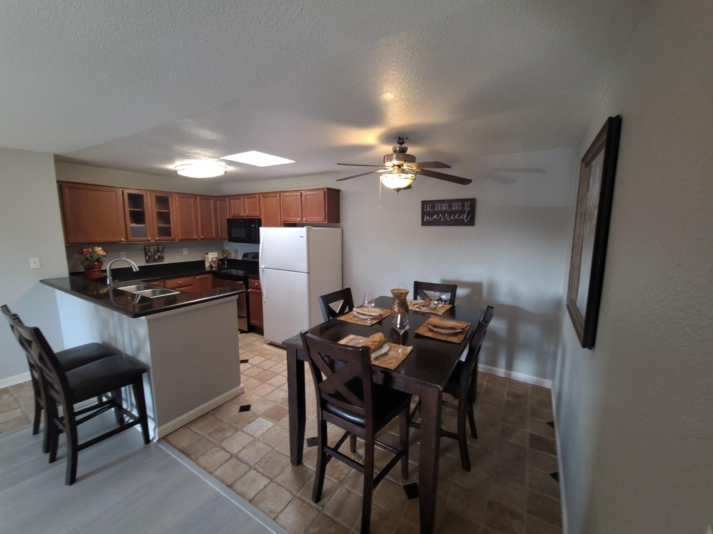 424 Dempsey Road, Unit 227 Milpitas, CA 95035 - Photo 9 of 24 a table and chairs in a kitchen