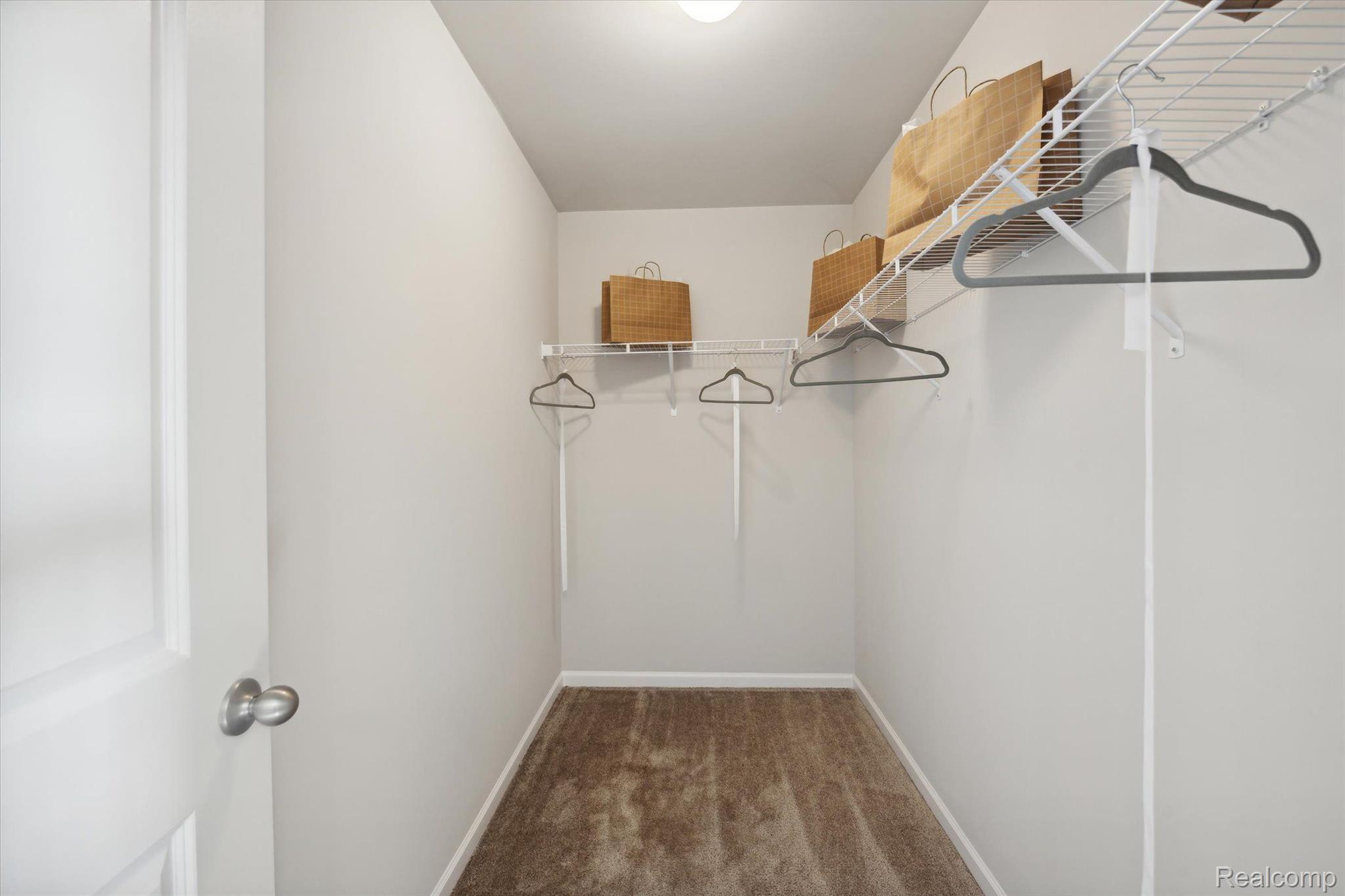 9917 Ridge Run Street, Unit 93 Howell, MI 48855 - Photo 12 of 21 2nd Bedroom Walk In Closet
