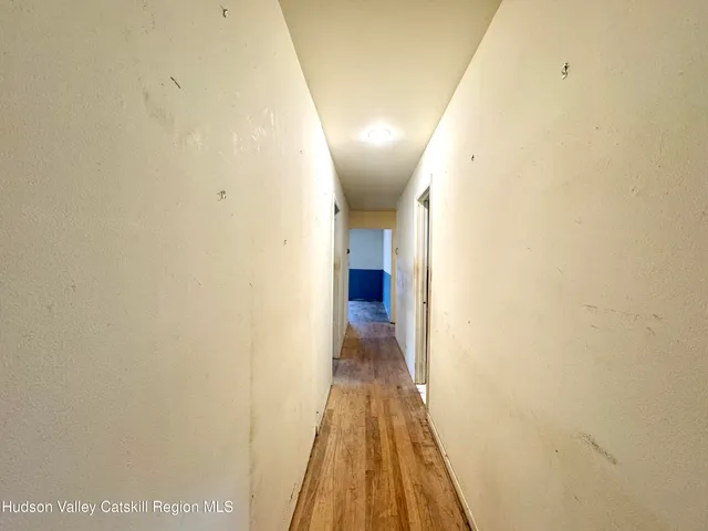 a bathroom with a tub a sink and a shower