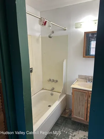 a bathroom with a sink toilet and mirror