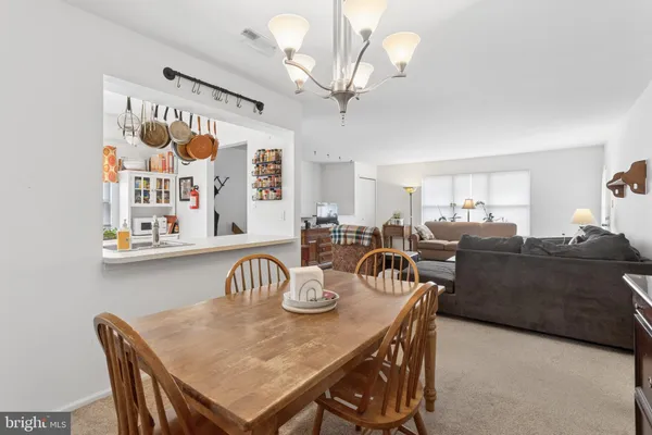 a kitchen with a sink a stove and cabinets