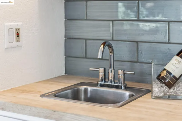 a view of storage and utility room with wooden floor