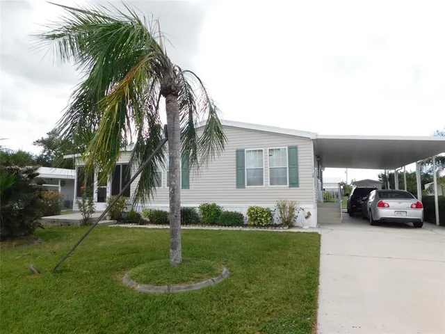 a couple of cars parked in front of a house
