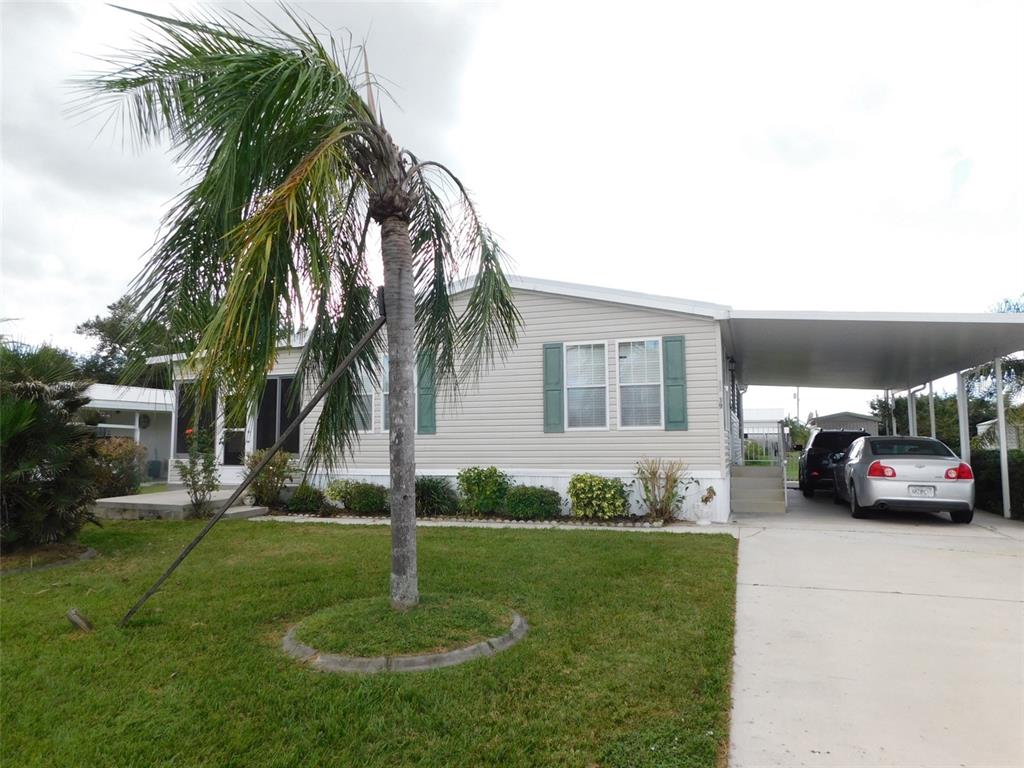 a couple of cars parked in front of a house