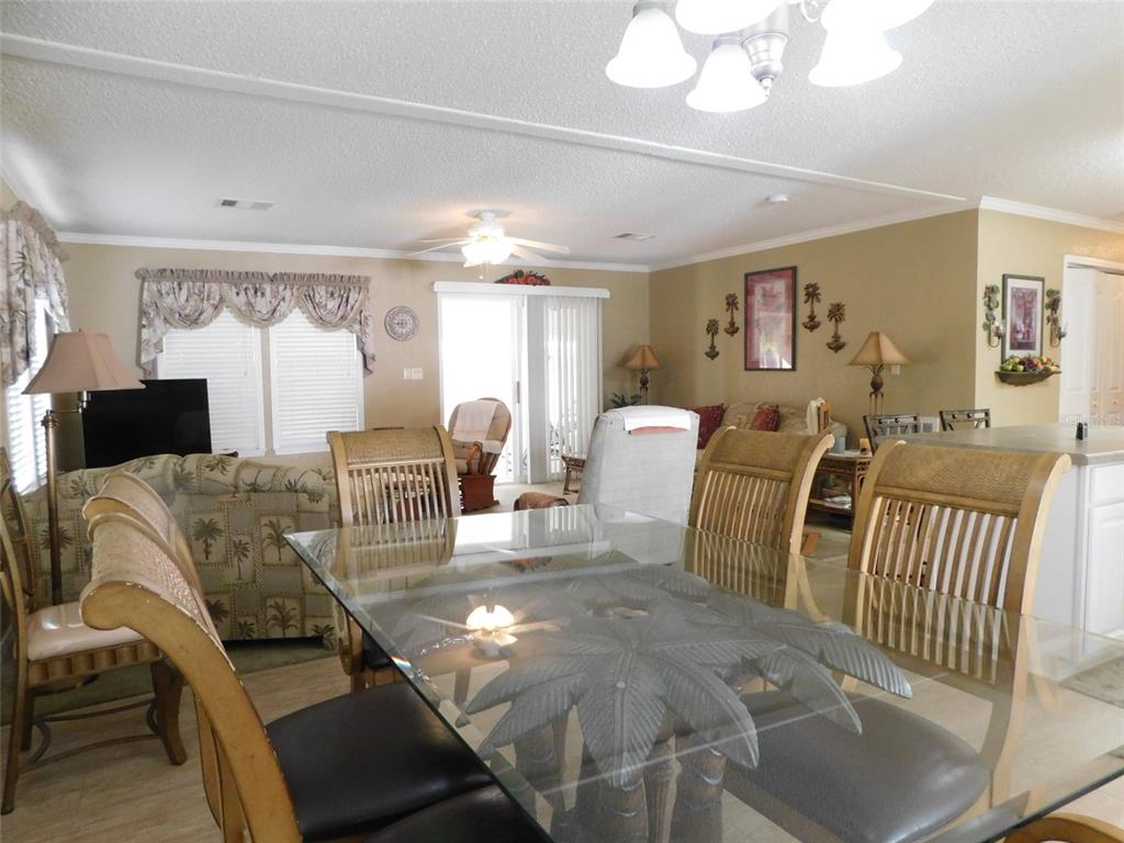 11739 Southwest Lemon Avenue Arcadia, FL 34269 - Photo 22 of 52 a living room with furniture and a flat screen tv