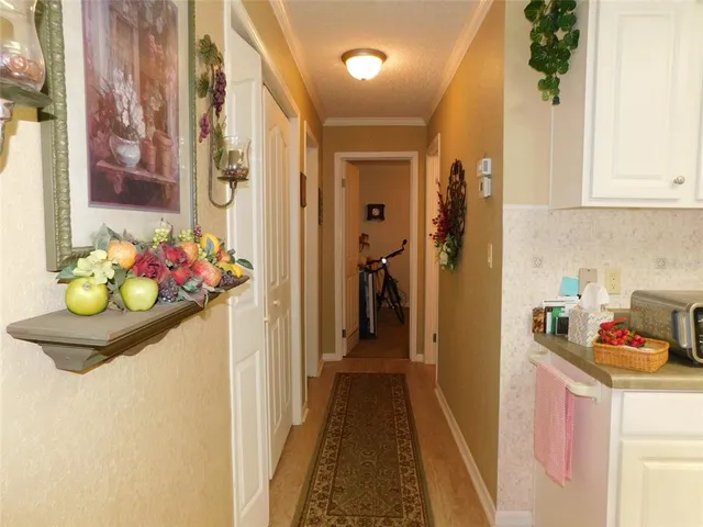 a bathroom with a sink mirror and cabinets