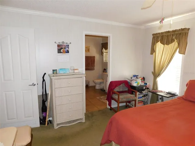 a bedroom with a bed and furniture