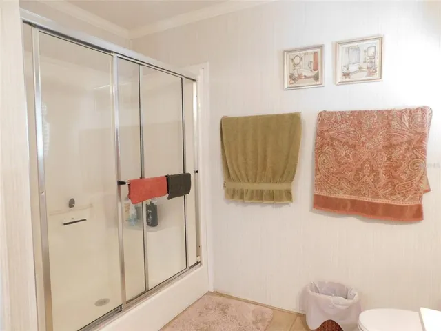 a bathroom with a shower and a sink