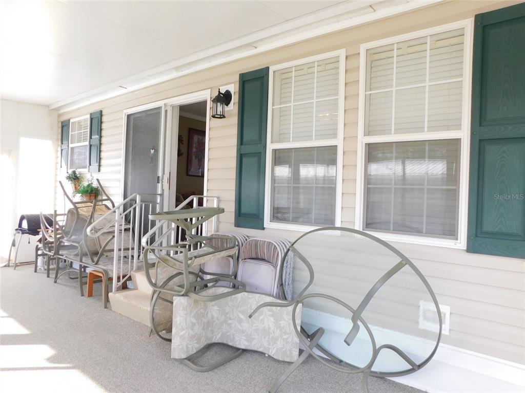 11739 Southwest Lemon Avenue Arcadia, FL 34269 - Photo 37 of 52 a room with gym equipment and large windows