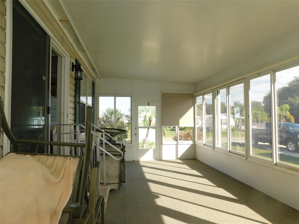 11739 Southwest Lemon Avenue Arcadia, FL 34269 - Photo 41 of 52 a view of a large room with wooden floor and windows