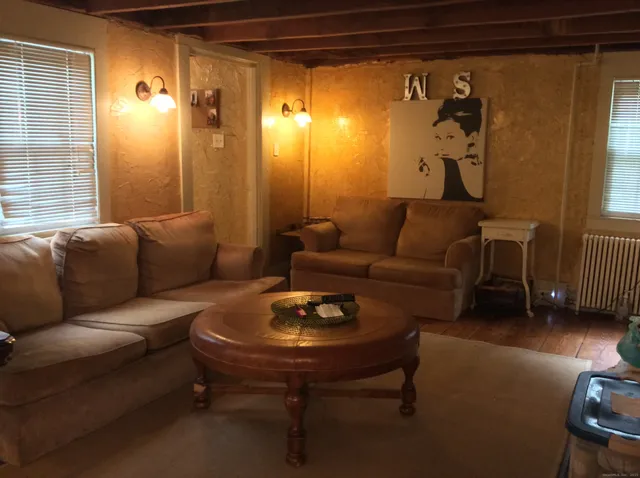 a living room with furniture and a table