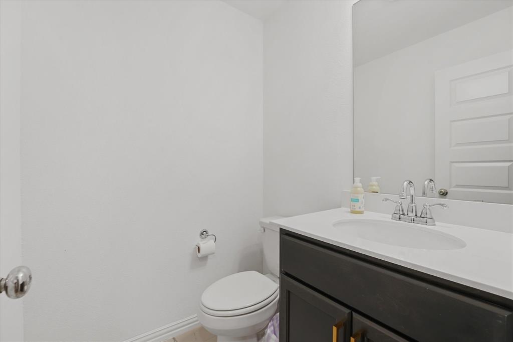 3533 Hyacinth Way Prosper, TX 75078 - Photo 24 of 38 a bathroom with a sink a toilet and mirror
