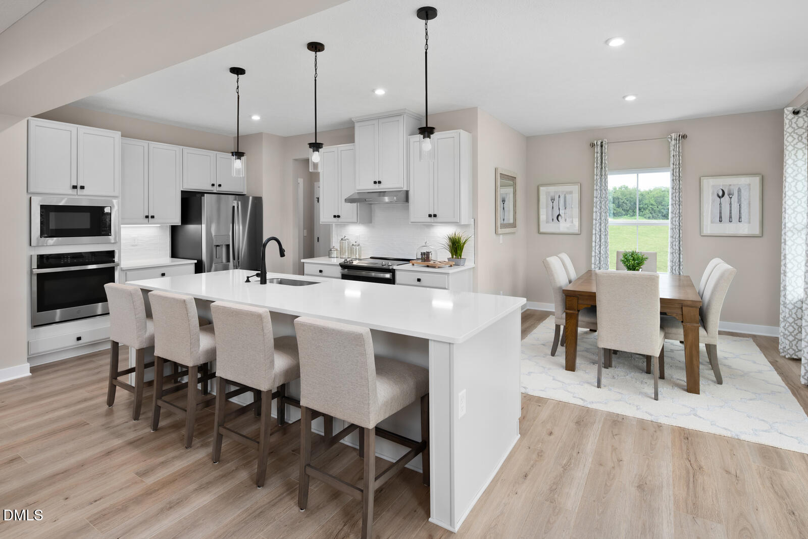 574 Freedom Trail Drive Willow Spring, NC 27592 - Photo 2 of 43 a large kitchen with a table and chairs