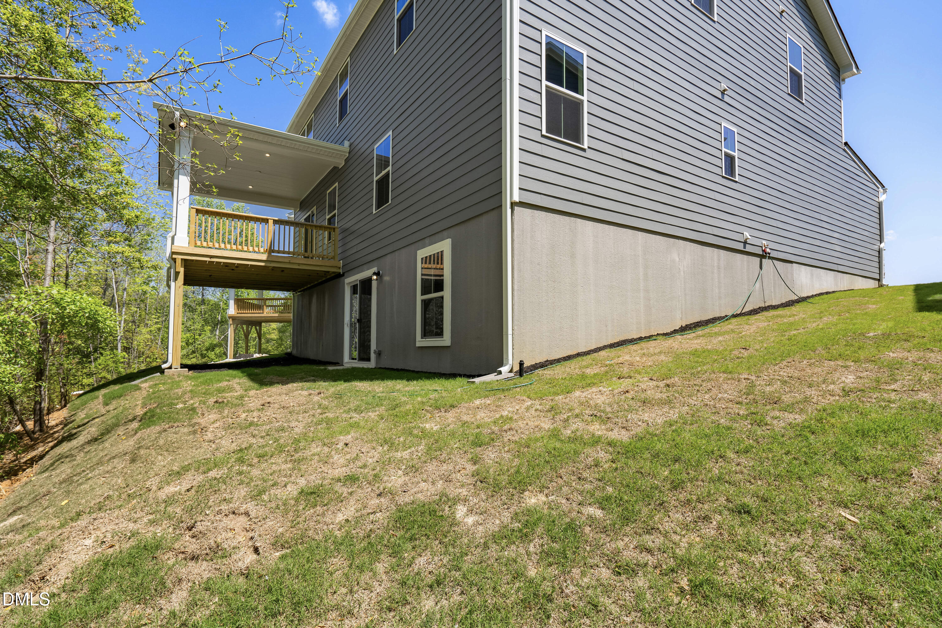 574 Freedom Trail Drive Willow Spring, NC 27592 - Photo 34 of 43 a view of an house with backyard and parking