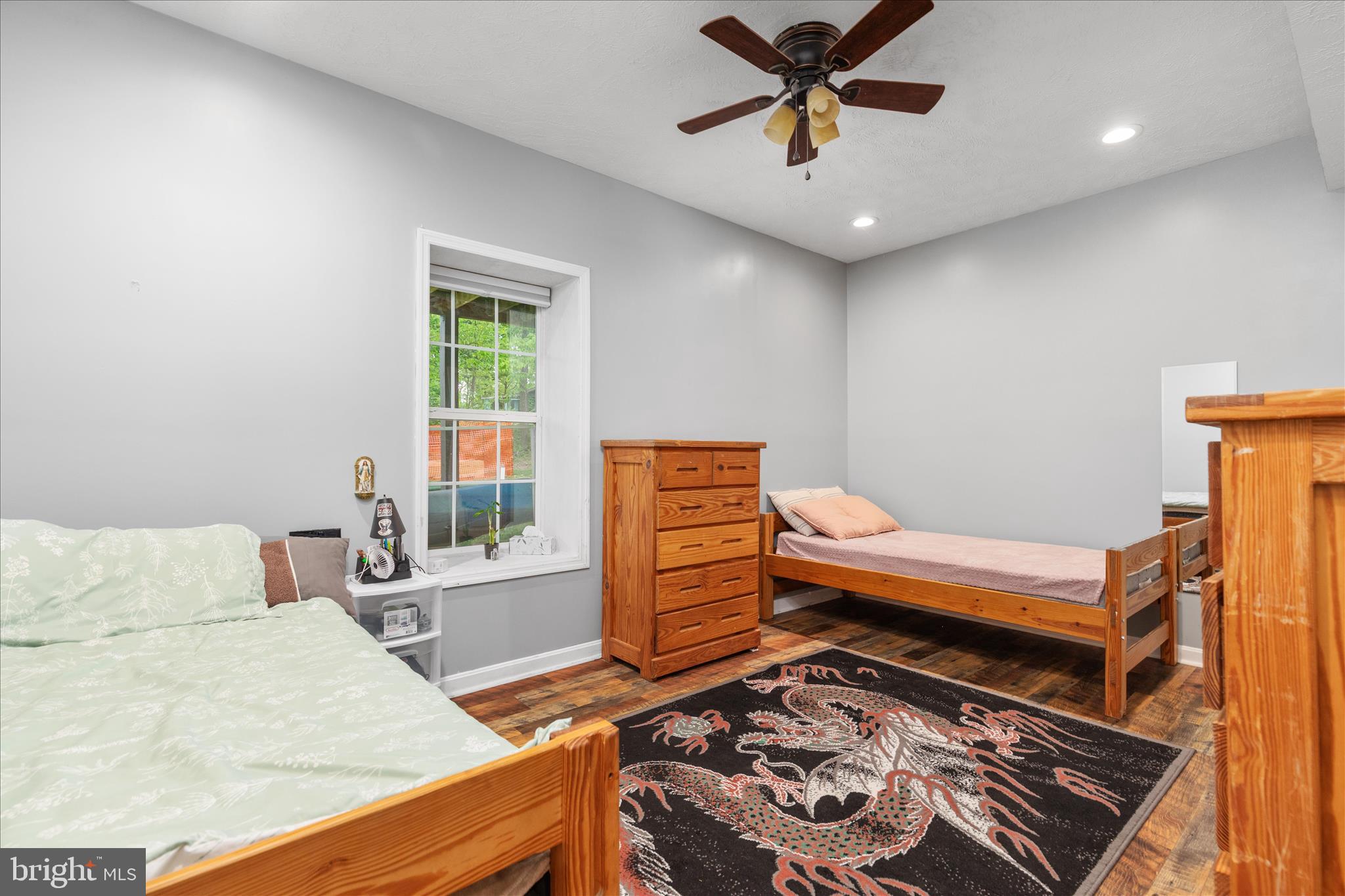 23 Cherrywood Road Front Royal, VA 22630 - Photo 14 of 33 a bedroom with a bed and a chandelier
