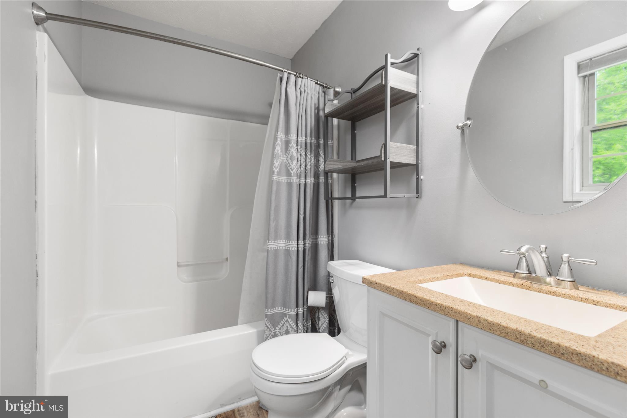 23 Cherrywood Road Front Royal, VA 22630 - Photo 10 of 33 a bathroom with a granite countertop sink toilet and shower